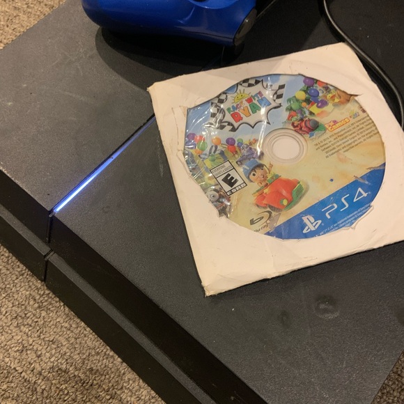 PS4 Console with Blue Controller and Game Disc and GTA 5 Also